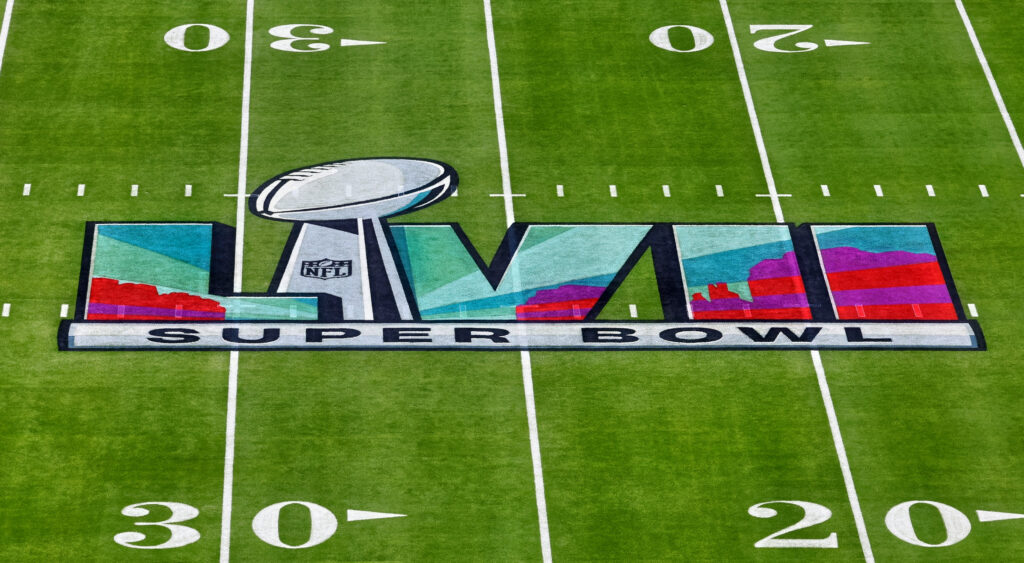 Super Bowl 57 logo on field of State Farm Stadium.