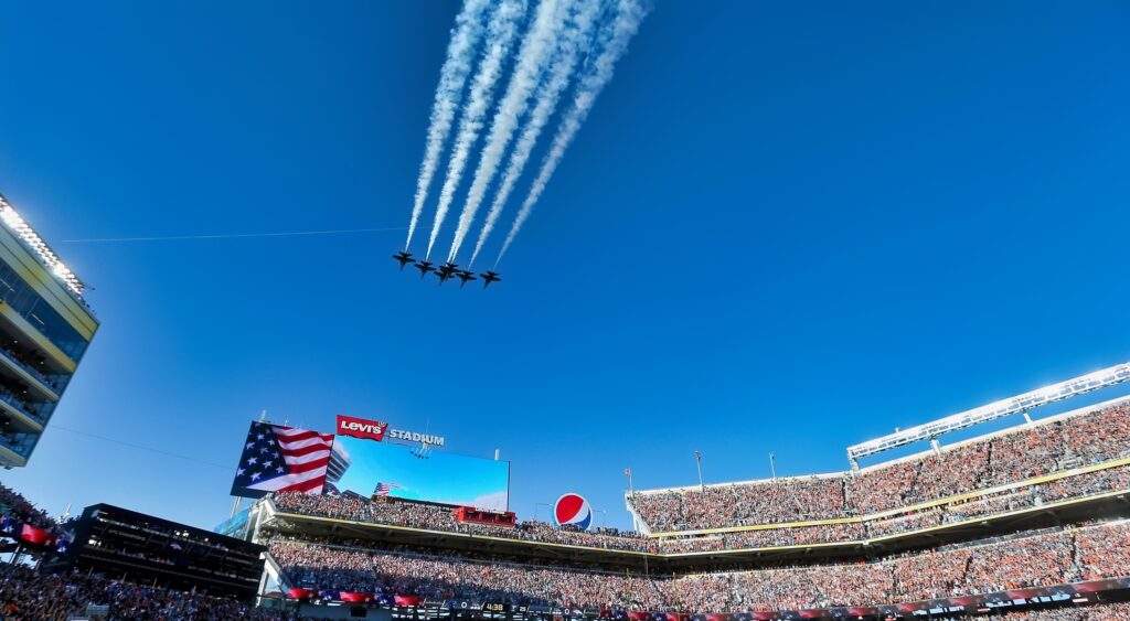 Jets fly over the stadium prior to the Super Bowl.
