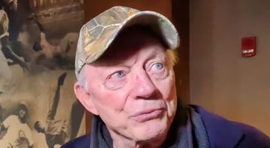 Jerry Jones with hunting cap on 