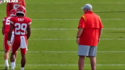 Andy reid on field with other players