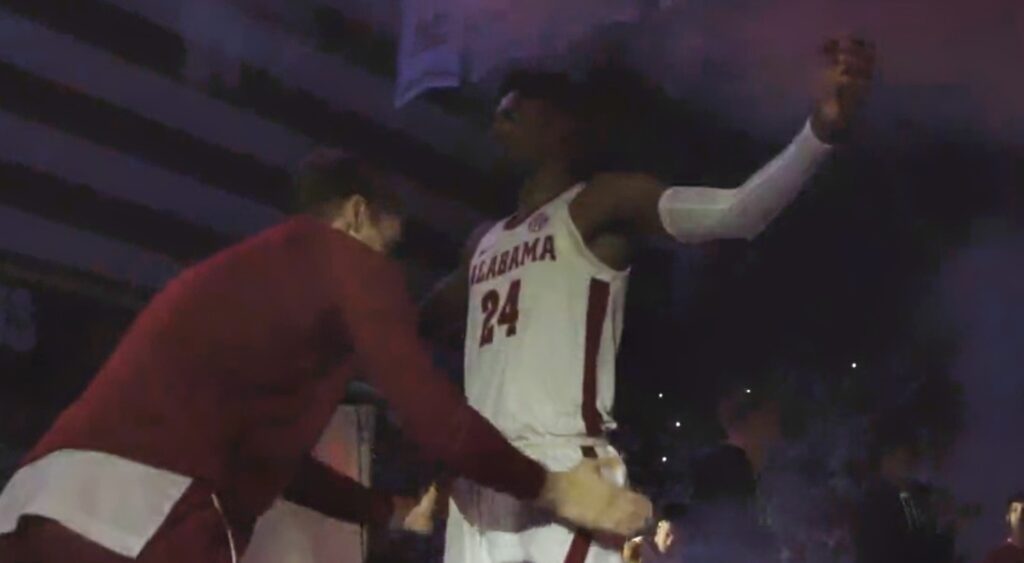 Alabama player patting down another one
