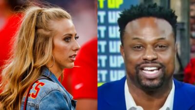 brittany mahomes staring while picture shows Bart Scott in blue suit