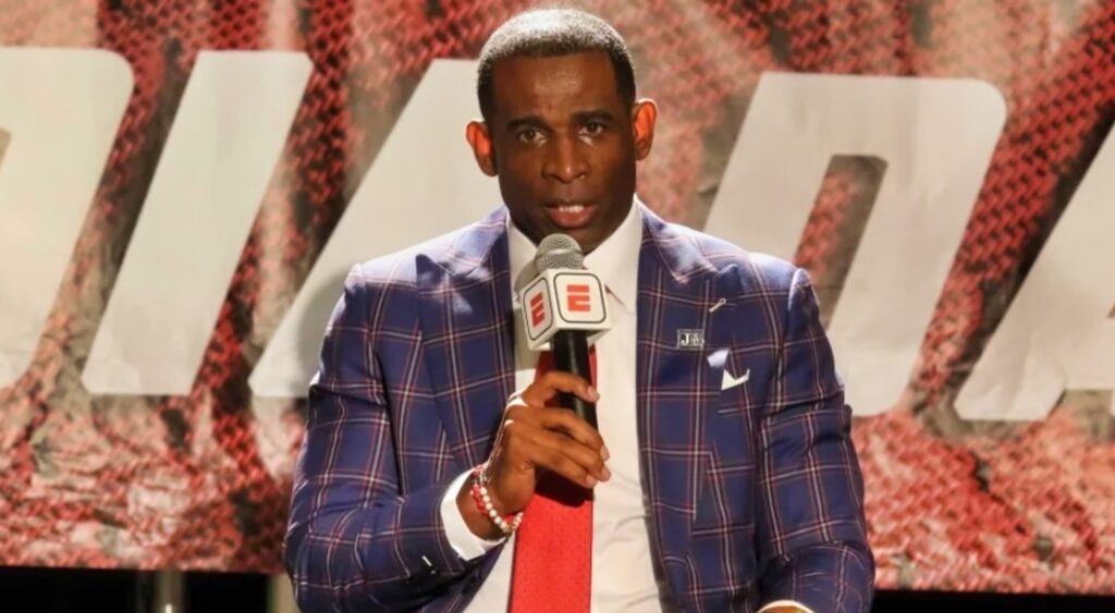 Deion sanders with ESPN mic in hand