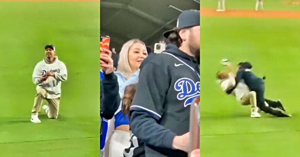Dodgers fan on one knee. Dodgers fan tackled by security