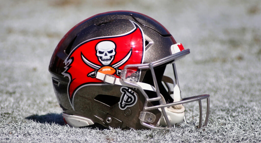 A Tampa Bay Buccaneers helmet shown lying on the field.