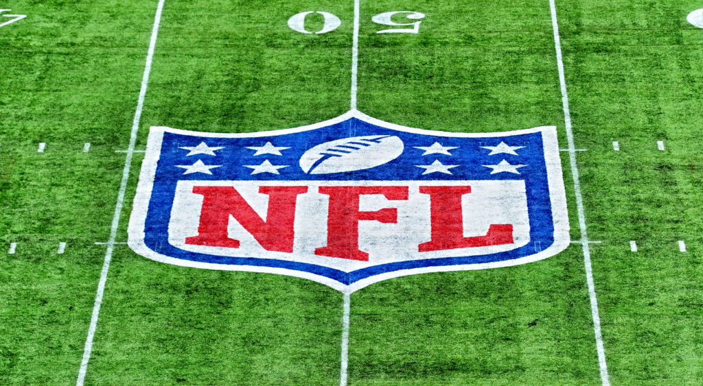 NFL logo center field of stadium.