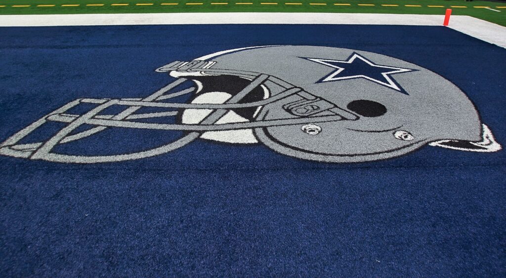 The Dallas Cowboys logo painted in their end zone.