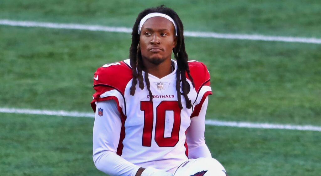Deandre Hopkins looks on without his helmet on.