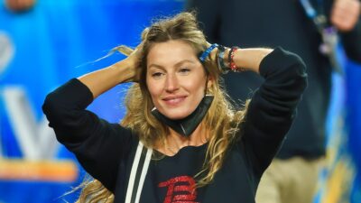 Gisele with her hands behind her head