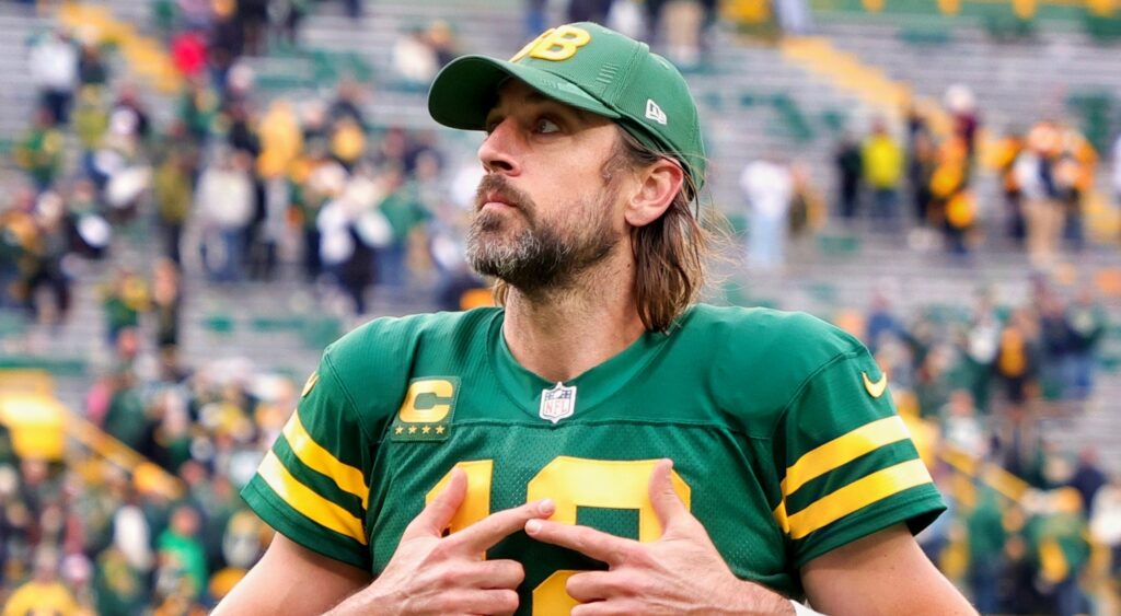 Aaron Rodgers looking up with no helmet on