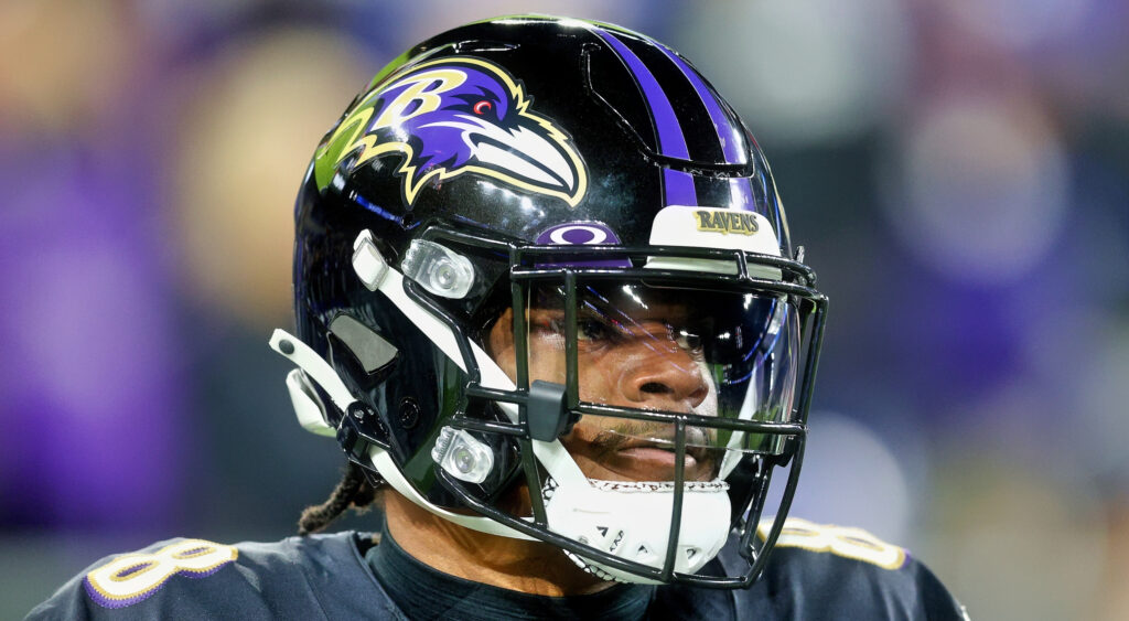 Lamar Jackson of Baltimore Ravens looking on while warming up.