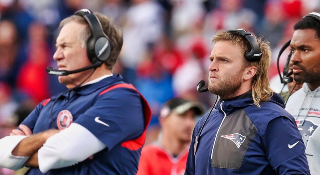 Steve Belichick stands alongside his dad, Bill, during a New England Patriots game.