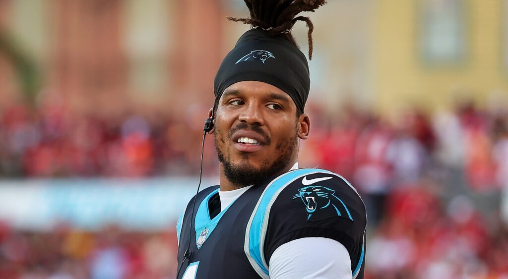 Cam Newton with no helmet on with Panthers