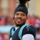 Cam Newton with no helmet on with Panthers