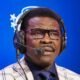 Michael irvin in suit and headset on