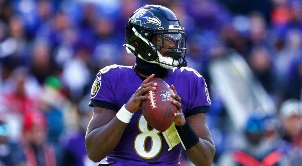 Baltimore Ravens' quarterback Lamar Jackson preparing to pass in 2022 game.