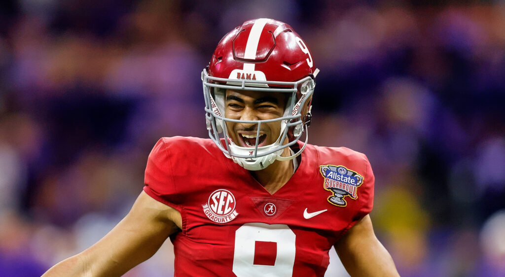 Alabama Crimson Tide quarterback Bryce Young smiling after throwing touchdown.