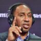 Stephen A. Smith with headset on and pointing his finger