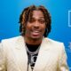 Jalen Ramsey in white suit at press conference for Dolphins