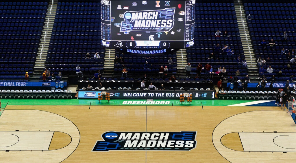 Basketball court bearing March Madness signage