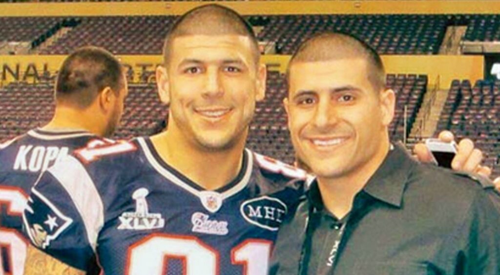Aaron Hernandez and brother DJ hugging and posing for picture