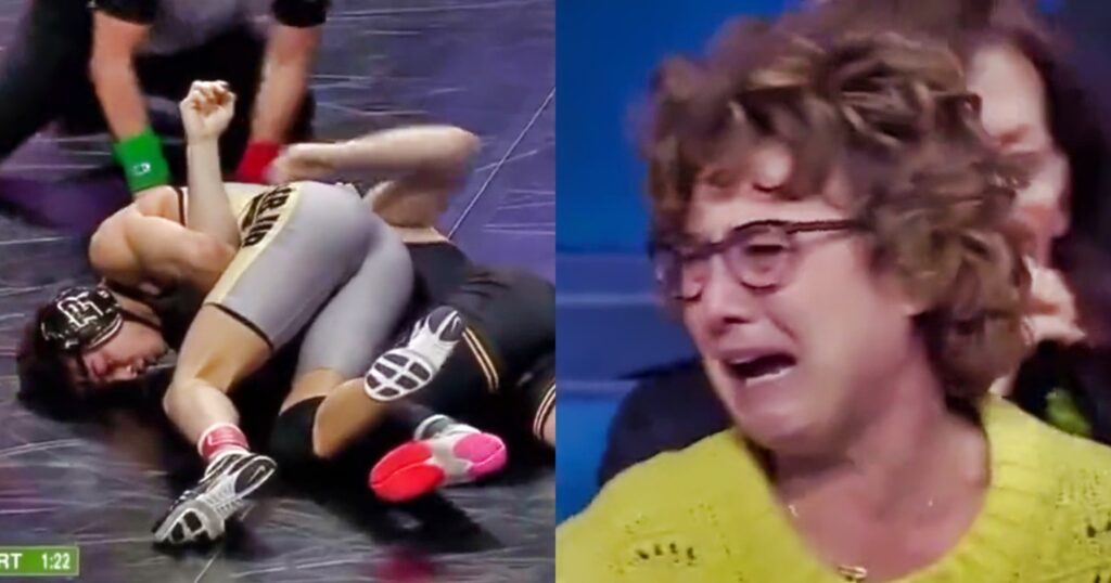 Two wrestlers on ground. Mom in yellow crying in the stands.