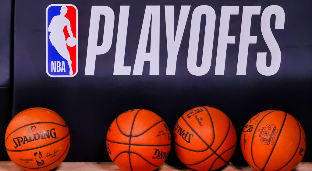 NBA basketballs in front of the NBA Playoffs logo.
