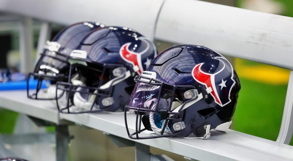 Texans helmets on bench