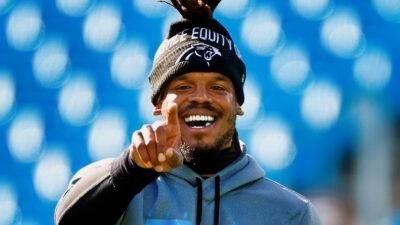 Cam Newton pointing and laughing