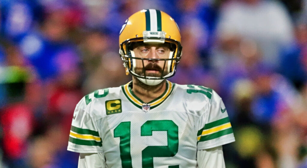 Aaron rodgers looking on.
