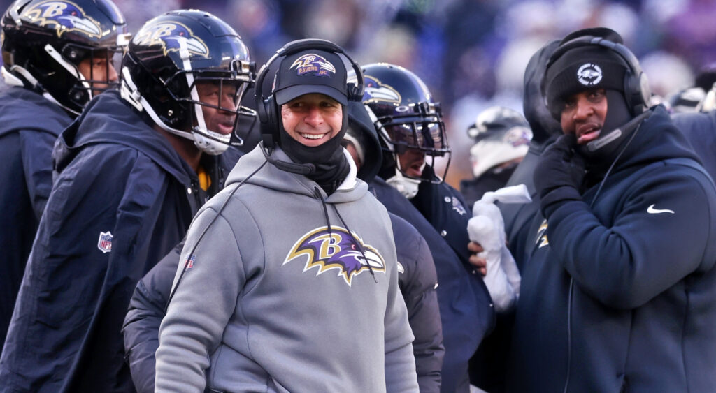 Baltimore Ravens' head coach John Harbaugh smiling during 2022 game.