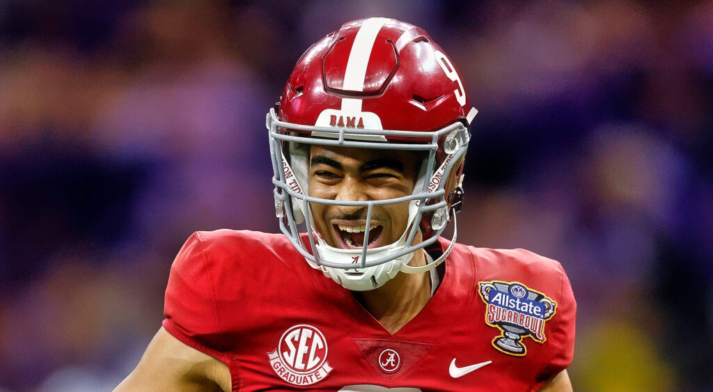 Alabama Crimson Tide quarterback Bryce Young smiling after throwing a touchdown.