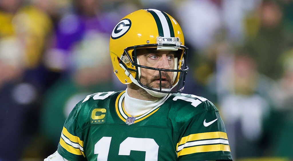 Green Bay Packers quarterback Aaron Rodgers looking to pass in 2023 game.