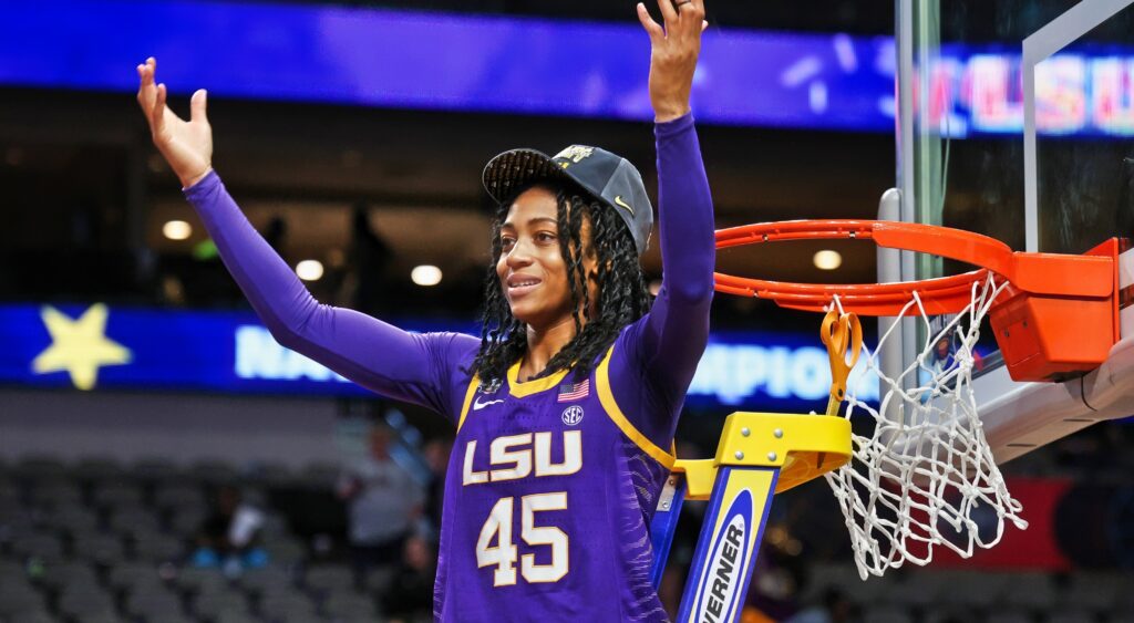 Alexis Morris raises her hands to the crowd while cutting down the net after winning the NCAA Women's Tournament.