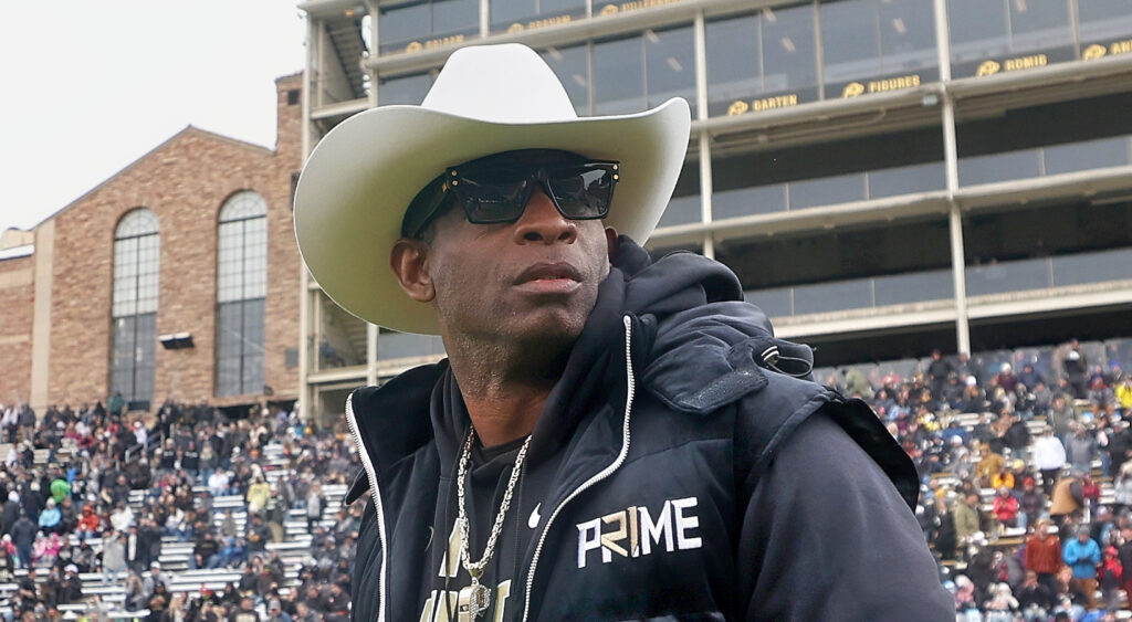Deion sanders in snow and cowboy hat