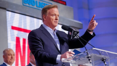 Roger Goodell pointing while behind podium