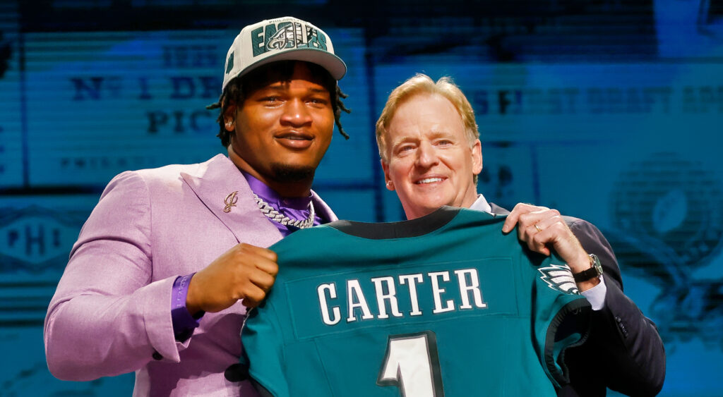 Jalen carter holding eagles jersey with roger goodell.