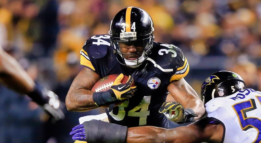 Ben Tate runs through a Ravens tackler while playing for the Steelers.