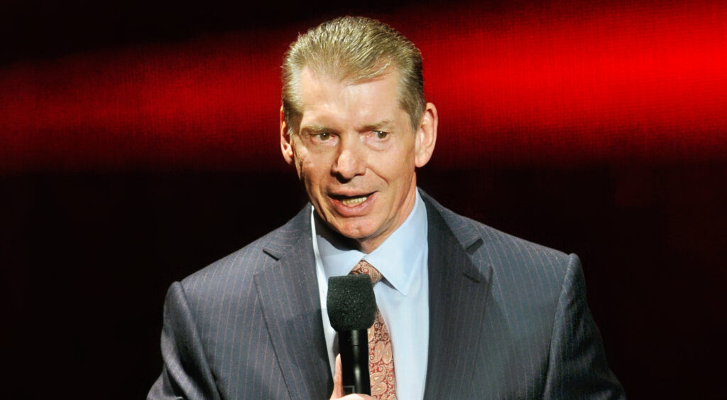 WWE chairman Vince McMahon speaking at a new conference.