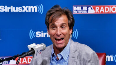 Chris Russo smiling with headset on