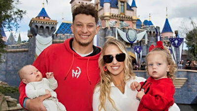 Brittany and patrick mahomes taking picture with kids
