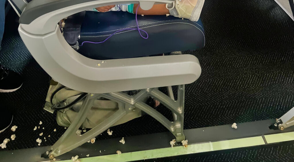 photo of popcorn on airplane floor