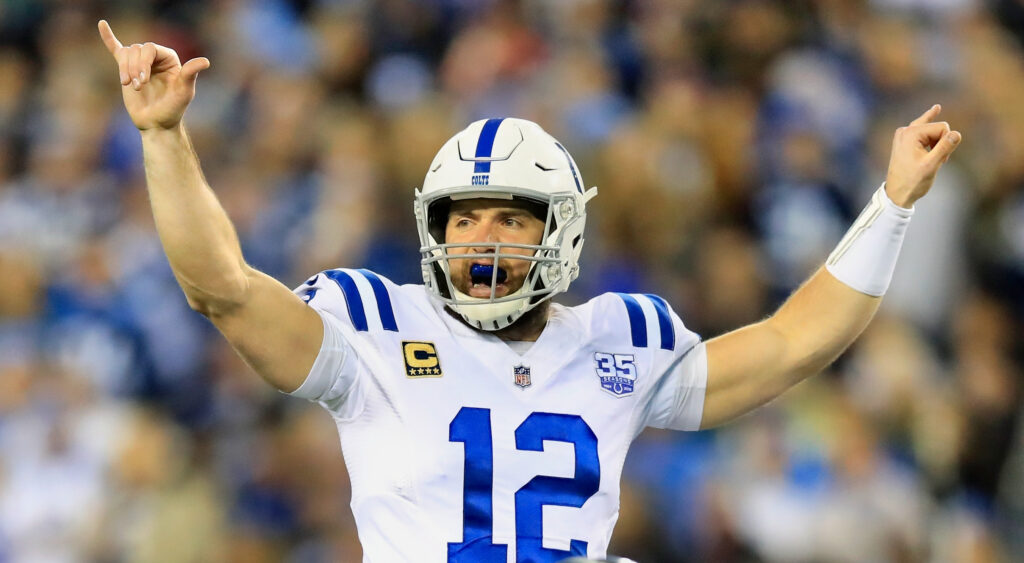 Andrew Luck with his hands in the air