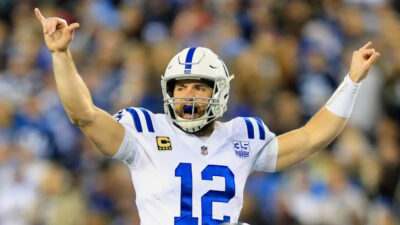 Andrew Luck with his hands in the air