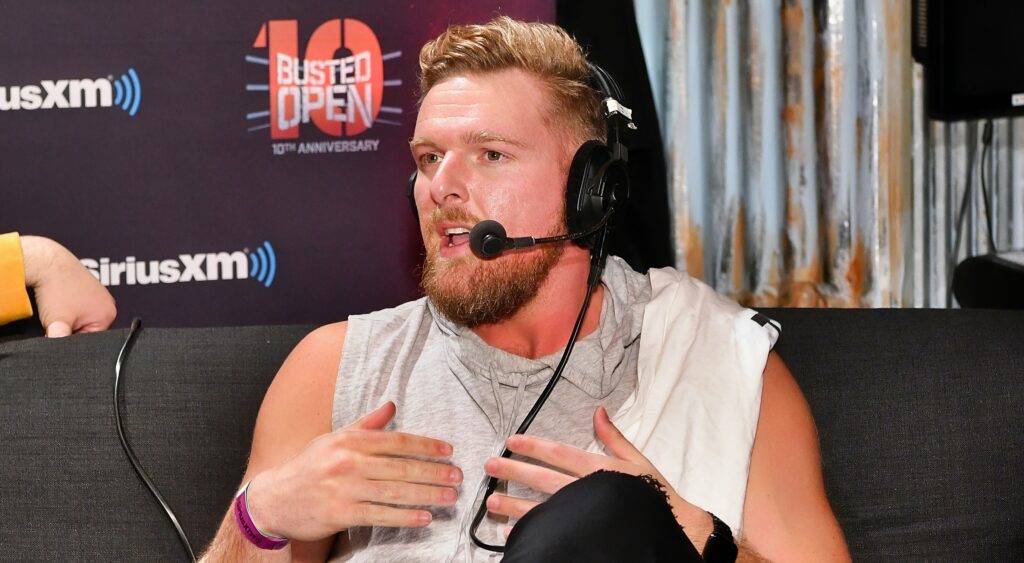 Pat McAfee speaks on a podcast.