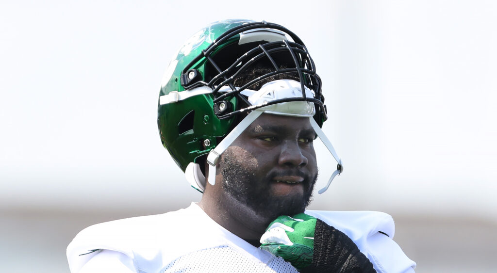 New York Jets' offensive tackle Mekhi Becton looking on during a practice.