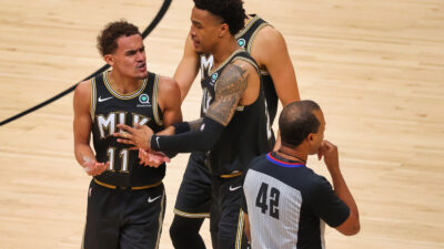 Trae Young arguing with referee Eric Lewis