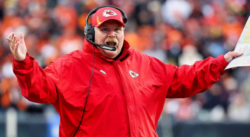 Andy Reid with hands up.