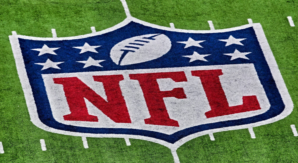NFL logo on field.