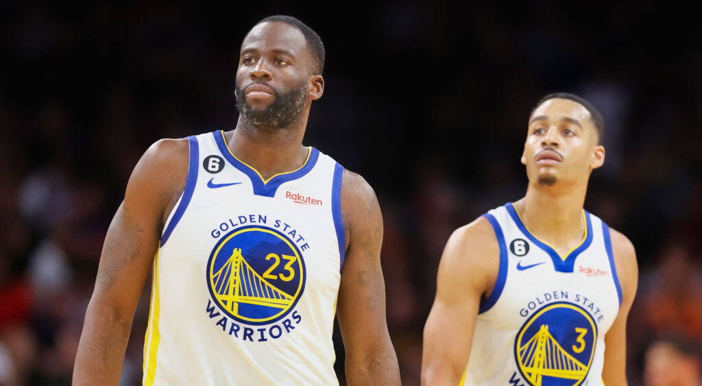 Draymond Green and Jordan Poole standing next to each other